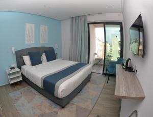 Postel nebo postele na pokoji v ubytování Gardenia Boutique Hotel