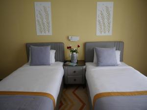 Postel nebo postele na pokoji v ubytování Gardenia Boutique Hotel