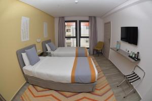 Postel nebo postele na pokoji v ubytování Gardenia Boutique Hotel
