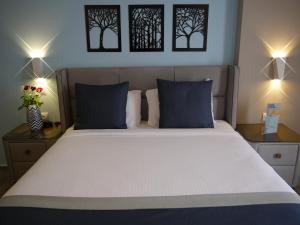 Postel nebo postele na pokoji v ubytování Gardenia Boutique Hotel