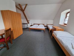 Postel nebo postele na pokoji v ubytování Penzion U Farmáře
