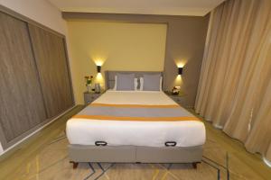 Postel nebo postele na pokoji v ubytování Gardenia Boutique Hotel