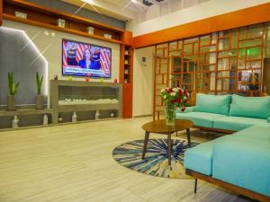 TV a/nebo společenská místnost v ubytování Gardenia Boutique Hotel