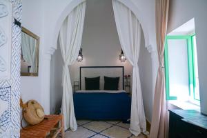 Postel nebo postele na pokoji v ubytování Riad Le Limoun and Spa