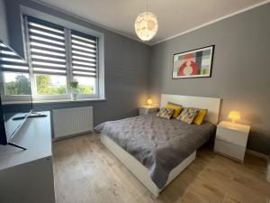 Posteľ alebo postele v izbe v ubytovaní Apartament HAMBURG