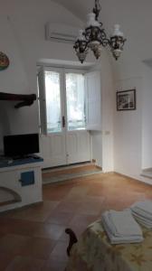TV a/nebo společenská místnost v ubytování B&B Il Patio