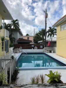 a swimming pool in the backyard of a house at Dee Jay Beach Resort in Fort Lauderdale