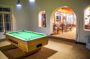 a pool table in the middle of a room at Katberg Mountain Resort & Hotel in Balfour