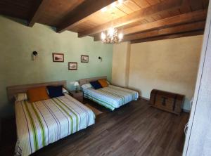 En eller flere senger på et rom på Casa rural Oliver y Nadia