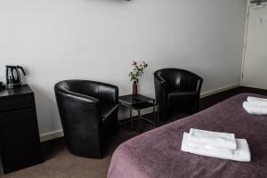 Een bed of bedden in een kamer bij Hotel de Gaaper