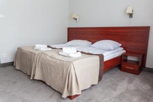 Posteľ alebo postele v izbe v ubytovaní POŁONINY Resort