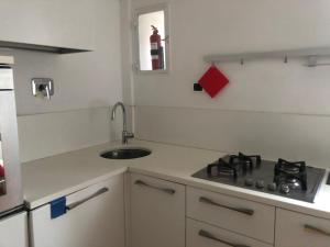a small kitchen with a sink and a stove at Appartamento Nel Cuore di Roma in Rome