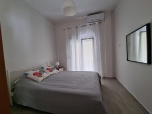 Vuode tai vuoteita majoituspaikassa Cosy and modern appartment in Olympiada