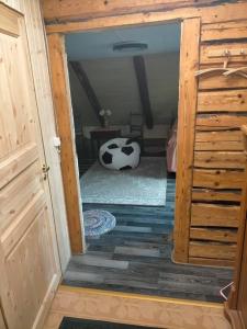 a door to a room with a cow in a room at Lossi 8 Põltsamaa Maida in Põltsamaa
