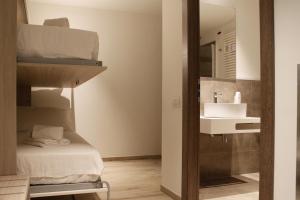 a bathroom with a bunk bed and a sink at Best Quality Hotel Politecnico in Turin +58 photos