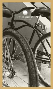 a black bike parked next to a table at Casa Laguna Chascomus in Chascomús