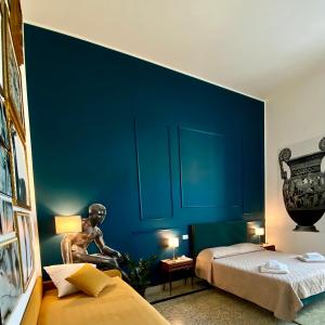 A bed or beds in a room at MONART HOSPITALITY Cavour
