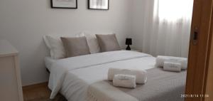 En eller flere senge i et værelse på Casal do Pinheiro