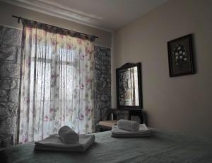 Posteľ alebo postele v izbe v ubytovaní Meterizi Guesthouse