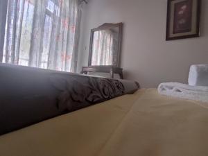 Posteľ alebo postele v izbe v ubytovaní Meterizi Guesthouse