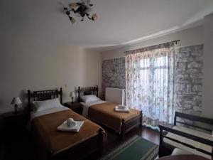 Posteľ alebo postele v izbe v ubytovaní Meterizi Guesthouse