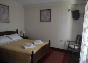 Posteľ alebo postele v izbe v ubytovaní Meterizi Guesthouse