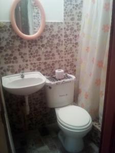 a bathroom with a toilet and a sink at Tony's House Eco Hostel in Huaraz +37 photos