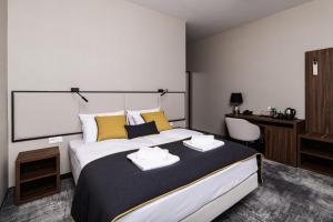 Postel nebo postele na pokoji v ubytování DReAM Boutique Residence