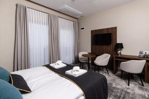 Postel nebo postele na pokoji v ubytování DReAM Boutique Residence