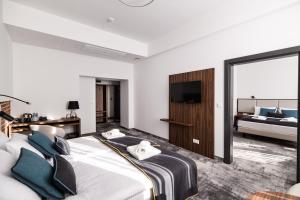 Postel nebo postele na pokoji v ubytování DReAM Boutique Residence
