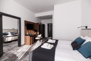 Postel nebo postele na pokoji v ubytování DReAM Boutique Residence