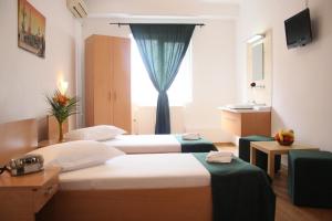 Postel nebo postele na pokoji v ubytování Hotel Sir Gara de Nord