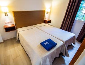 A bed or beds in a room at Eden Meloneras by TAM Resorts