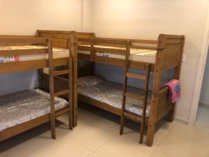 Ένα ή περισσότερα κρεβάτια σε δωμάτιο στο Apartamento em Laguna no Mar Grosso, com excelente localização, cobertura!