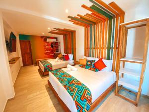 a bedroom with two beds and a ladder at In Di House of Reggae Boutique in San Andrés