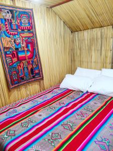 Postel nebo postele na pokoji v ubytování Uros Maya Lodge