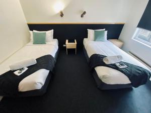 Ένα ή περισσότερα κρεβάτια σε δωμάτιο στο Pedder Wilderness Lodge