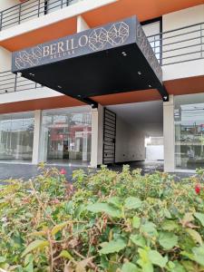 a building with a sign that reads berkeley center at Berilo Deluxe Apartahotel in Barranquilla