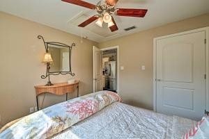 a bedroom with a bed and a ceiling fan at Charming Fort Worth Apartment - 8 Mi to Downtown! in Fort Worth
