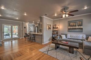 a living room with a couch and a table at Stylish Home - Walk to Texas Tech University! in Lubbock
