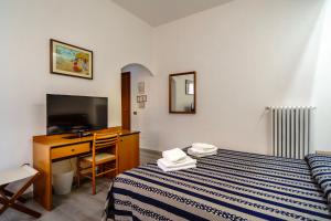 Postel nebo postele na pokoji v ubytování Albergo Martini