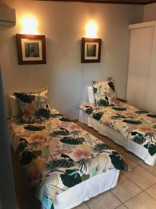 Rúm í herbergi á Le Passiflore