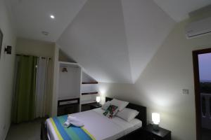 Katil atau katil-katil dalam bilik di Le Ronce Villa