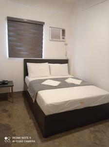 En eller flere senge i et værelse på 8 Zhensen Inn
