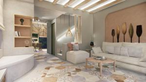 a living room with a couch and a table at Villas Plumeria in Palaiochora