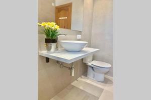 a bathroom with a sink and a toilet at CASA PISCINA DOCTOR FLEMING 51 in Llubí +15 photos