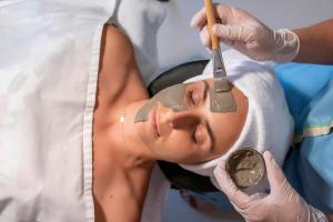 a woman getting her face examined by a dentist at Aqua Natura Bay in Porto Moniz