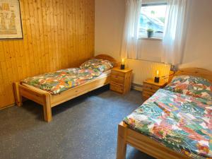 Postel nebo postele na pokoji v ubytování Ferienwohnung Stargardt in Bad Münder 6 Personen Soutterain