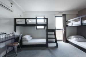 Postel nebo postele na pokoji v ubytování Taichung Box Design Hotels