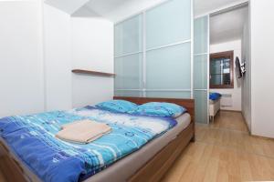 Postel nebo postele na pokoji v ubytování Apartment House Kamzik 26